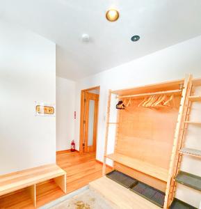a room with a wall that is being remodeled at Ajito Niseko in Kutchan