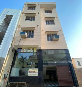 a building with a store front with a window at Rudravasa Inn in Varanasi