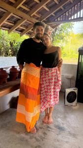 a man and a woman posing for a picture at Ovis kitchen in Matara +2 photos