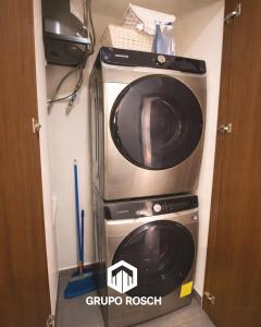 two microwaves are stacked on top of each other at Apartamento con Piscina in Las Victorias +2 photos