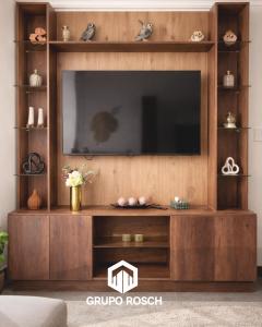 a large entertainment center with a television in a living room at Apartamento con Piscina in Las Victorias