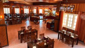 an overhead view of a restaurant with tables and chairs at Kingswood Tea Factory in Ramboda