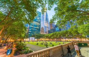 a park in a city with tall buildings at LUMA Hotel - Times Square in New York