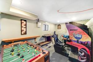 a play room with a pool table and a motorcycle on the wall at Lakeside Serenity in Crestline