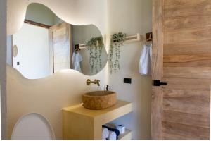 a bathroom with a sink and a mirror at Corales de Isla Fuerte in Puerto Limón +52 photos