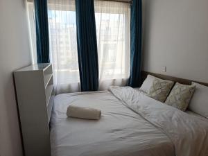a bed with a pillow on it in a bedroom at Nyumbani in Nairobi