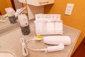 a nintendo wii controller sitting on top of a counter at HP Jōshin in Nagoya