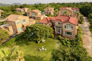 an aerial view of a large house with a yard at Dulle House Jeju in Jeju
