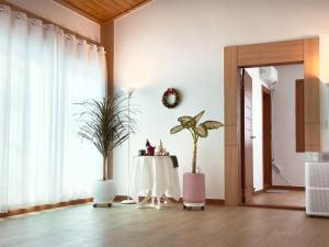 a dining room with a table and a plant at Mooldan Dongsan Taean in Taean +24 photos