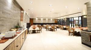 a dining room with tables and chairs in a restaurant at Tourist Hotel Sacheon in Sacheon