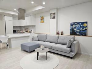 a living room with a couch and a table at Paju Byeol-bom in Paju +13 photos