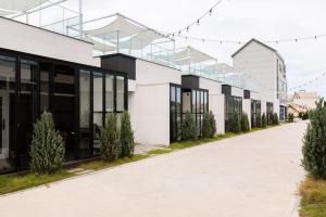 a white building with a row of windows at Pool Lounge Pension & Glamping in Yangyang +26 photos