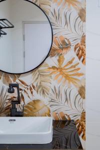 a bathroom with a mirror and a sink at Only U Home-Stay Villa Huahin in Hua Hin +37 photos