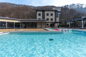 a large pool of water in front of a building at Chaeonjae Gongju in Gongju