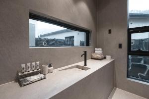 a bathroom with a sink and a large window at Chaeonjae Gongju in Gongju +12 photos