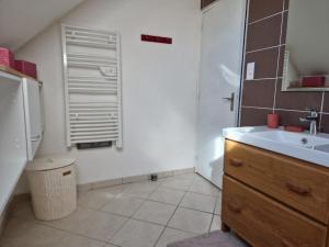a small bathroom with a sink and a mirror at Les Terrasses de Laguiole in Laguiole +39 photos