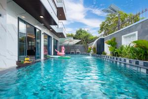 a swimming pool in the backyard of a house at Villa B2-34 Long Cung in Vung Tau