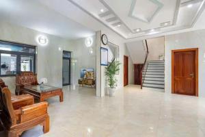 a large living room with a clock on the wall at Villa B2-10 Long Cung in Vung Tau