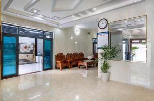 a waiting room with a clock on the wall at Villa B2-10 Long Cung in Vung Tau +34 photos