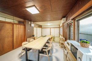 a conference room with a long table and chairs at Yuen in Beppu
