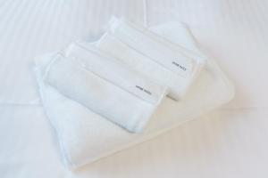 two white towels sitting on top of a table at Kent Clair Ishigaki Bay in Ishigaki Island +101 photos