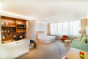 Postel nebo postele na pokoji v ubytování NLH FIX | Neighborhood Lifestyle Hotels