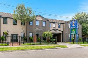a building with a sign in front of it at Quality Apartments Dandenong in Dandenong