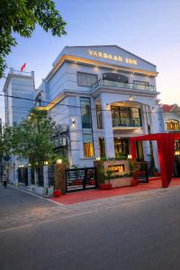 a white building with a sign that reads vancouver inn at Hotel Vardaan Inn in Lucknow