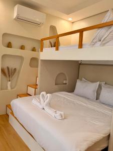 a bedroom with a bed with two bunk beds at Grand De Raj in Angeles +31 photos