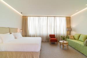 Postel nebo postele na pokoji v ubytování NLH FIX | Neighborhood Lifestyle Hotels