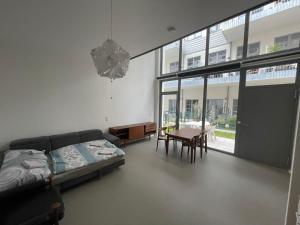 a bedroom with a bed and a table and chairs at moderne Loft in Vienna