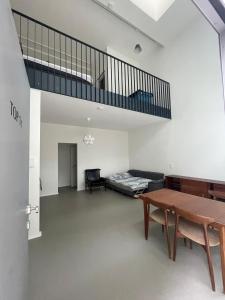 a living room with a table and a couch at moderne Loft in Vienna