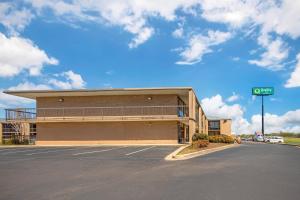an empty parking lot in front of a building at Quality Inn Columbus, MS in Columbus
