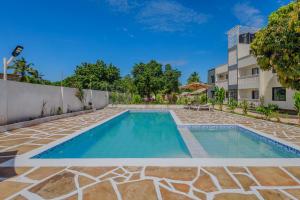 a swimming pool in the backyard of a house at Marahaba Holiday Suites Ground Floor 1BR 5 Min Drive to Nomad Beach in Ukunda