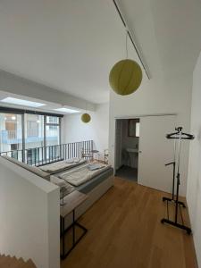 a bedroom with a large bed in a room at Modern Loft mit Terrasse in Vienna