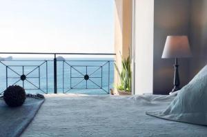 a bedroom with a bed with a view of the ocean at Bay View Grand Ixtapa Exclusive in Ixtapa
