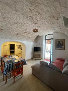 a living room with a couch and a table at Villa Coco Monopoli in Monopoli