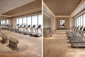 a gym with treadmills and ellipticals and windows at Merit Crystal Cove Hotel Casino & SPA in Kyrenia
