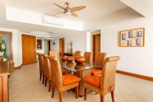 a dining room with a table and chairs at Bay View Grand Ixtapa Exclusive in Ixtapa
