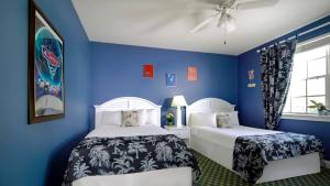 Postel nebo postele na pokoji v ubytování Calypso Cay Vacation Villas