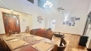 a dining room with a table and a couch at Mara Villa Katunayake - 5 Mins to Colombo Airport in Katunayaka