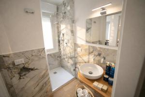 a bathroom with a toilet and a sink and a shower at Residenza Ximenes Hub in Palermo +37 photos