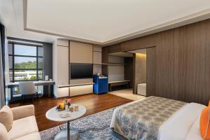 a hotel room with a bed and a table at Fortune Select Siliguri- Member ITC Hotels' Group in Siliguri
