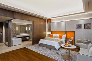 a hotel room with a bed and a bathroom at Fortune Select Siliguri- Member ITC Hotels' Group in Siliguri +32 photos
