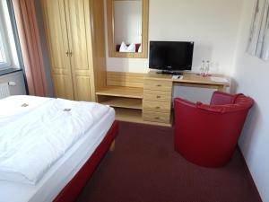 Postel nebo postele na pokoji v ubytování Hotel Weserschiffchen