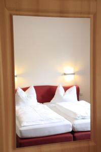 Postel nebo postele na pokoji v ubytování Hotel Weserschiffchen