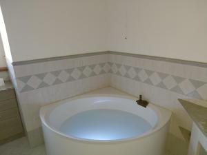 a bathroom with a white toilet in a room at Gaia - Lake View Terrace & Beach Access Oasis in Lierna +25 photos