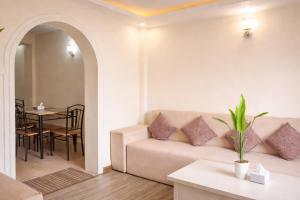 a living room with a couch and a table at Thamel Central Apartment in Kathmandu