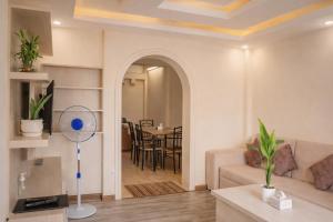 a living room with a couch and a table at Thamel Central Apartment in Kathmandu
