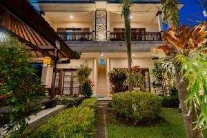 a house with a lot of plants and trees at Umah Gatra Ubud in Ubud